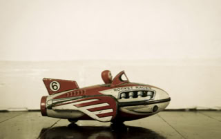 Antique rocket racer toy